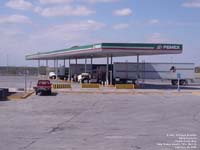Mexican drivers fuel their trucks in a Pemex gas station near Nuevo Laredo.