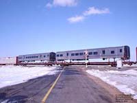 A westbound CN train hauls some Bombardier passenger cars