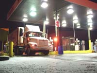 A US FoodService semi truck is fueled in a Champlain,NY truck stop.