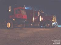 A yard tractor and a Peterbilt highway tractor