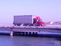 A White-GMC tractor carries mail out of South Padre Island,TX