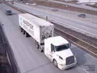 A Volvo truck hauls a Maersk Sealand container in Montreal.