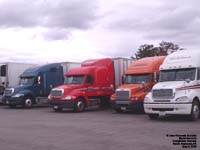 Four Freightliner tractors